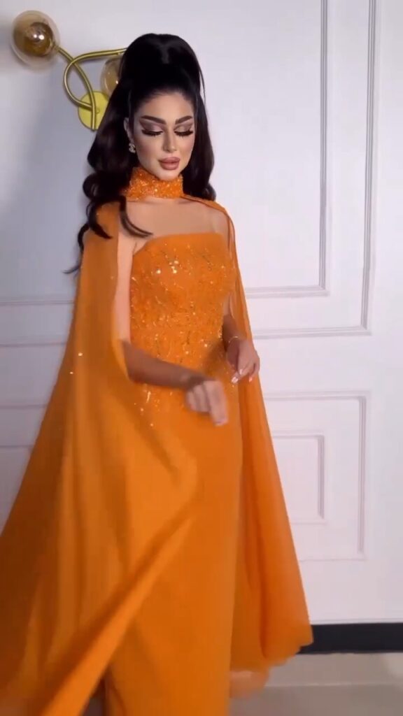 ⁦فستان سهرة لون برتقالي⁩ - الصورة ⁦4⁩