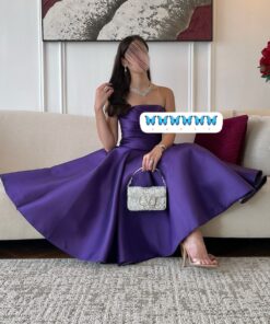 فستان سهرة بنفسجي أنيق بكتف مكشوف وقصة منفوشة