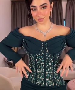 فستان سهرة أزرق بترولي مطرز بتصميم أوف شولدر وأكمام فاخرة