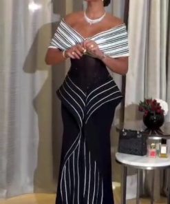 فستان سهرة أسود وأبيض بخطوط طولية وتصميم كتف درامي – إطلالة فاخرة وعصرية | روزيتا السعودية