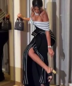 Alternative view of فستان سهرة أسود وأبيض بخطوط طولية وتصميم كتف درامي إطلالة فاخرة وعصرية