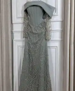 فستان سهرة زيتي فاخر مطرز بتصميم أوف شولدر وأكمام شفافة