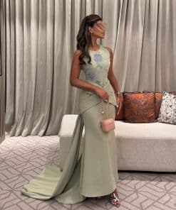 فستان سهرة أخضر باستيل فاخر بتطريز ناعم وخصر درابيه