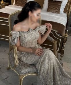 فستان سهرة شامبين مطرز بالكريستال بأكمام أنيقة