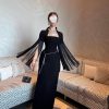 فستان سهرة أسود فاخر مع شال شراشيب