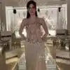 فستان سهرة شامبين طويل بكورسيه مرصع وتنورة شراشيب