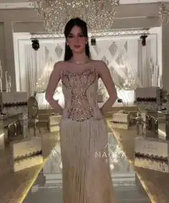 فستان سهرة شامبين طويل بكورسيه مرصع وتنورة شراشيب