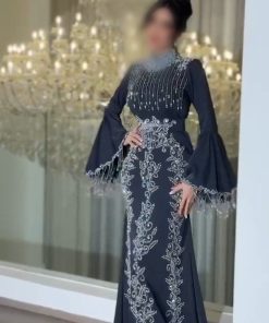 فستان سهرة أسود طويل مطرز فضي بياقة عالية وأكمام كلوش