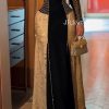 فستان سهرة أسود بتطريز ذهبي وتصميم كيب أمامي