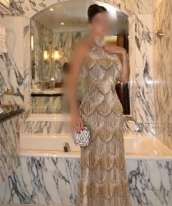 فستان سهرة ذهبي ميتاليك برقبة مرتفعة وشراشيب متناسقة